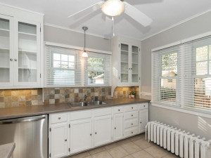 Photo for 991 Stryker Avenue, West Saint Paul, MN 55118 - Listing #6109307 Stone tile backsplash, tiled floors, ceiling fan, under the cabinet and pendant lighting plus full of natural light.