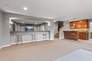 Photo for 11610 Aster Lane, Woodbury, MN 55129 - Listing #6114865 A wet bar offers additional seating, bar sink, microwave and beverage fridge.