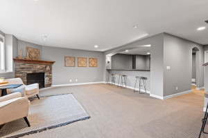 Photo for 11610 Aster Lane, Woodbury, MN 55129 - Listing #6114865 The counter seating overlooks the theatre room, offering additional seats for those enjoying snacks while watching a movie.