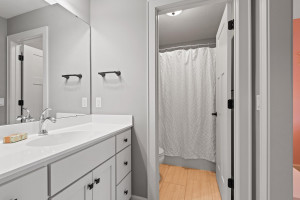 Photo for 11610 Aster Lane, Woodbury, MN 55129 - Listing #6114865 Featuring a large vanity, tile floors and a compartmentalized tub/shower and toilet, the en-suite bath offers convenience and privacy.