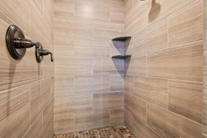Photo for 11610 Aster Lane, Woodbury, MN 55129 - Listing #6114865 The walk-in shower features dual shower heads and custom tile.
