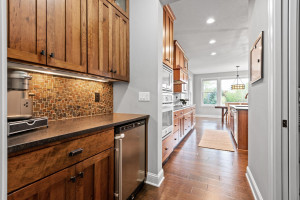Photo for 11610 Aster Lane, Woodbury, MN 55129 - Listing #6114865 The kitchen features incredible pantry space and a coffee bar with built-in storage and wine fridge.