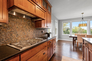 Photo for 11610 Aster Lane, Woodbury, MN 55129 - Listing #6114865 The gas range is highlighted by this unique tile backsplash.