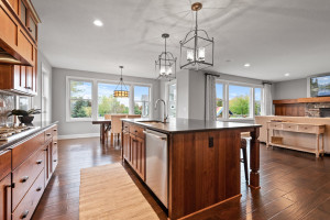 Photo for 11610 Aster Lane, Woodbury, MN 55129 - Listing #6114865 A luxurious oversized island can be used for eating, preparing meals, and entertaining. Drop-down pendant lights add extra-chic flair.