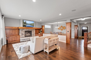 Photo for 11610 Aster Lane, Woodbury, MN 55129 - Listing #6114865 Flanked by built-ins, this cozy gas fireplace with stacked stone surround provides the perfect focal point for the living room.
