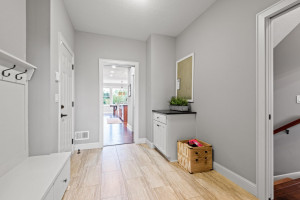 Photo for 11610 Aster Lane, Woodbury, MN 55129 - Listing #6114865 The large mudroom off the garage has plenty of storage for coats, backpacks and shoes, as well as a drop station for keys, mail or the family calendar.
