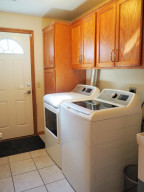 Photo for 3801 Riverton Avenue, Eagan, MN 55122 - Listing #6116062 Laundry room with new W/D, storage space, and walkout to backyard.