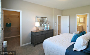 Photo for 373 Freedom Lane, Delano, MN 55328 - Listing #6127482 Another view of the primary bedroom, this one highlighting the access point for one of two walk-in closets. Photo of model, colors will vary