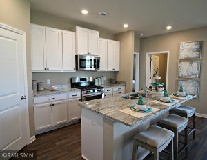Photo for 373 Freedom Lane, Delano, MN 55328 - Listing #6127482 Kitchen has ample counter space and lots of cabinet space. The perfect space for making everyday meals or memorable special occasion dinners. Photo of model, colors will vary