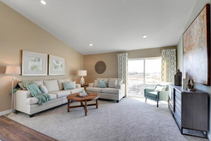 Photo for 345 Freedom Lane, Delano, MN 55328 - Listing #6127490 The main level family room will hold most any furniture arrangement, and like the rest of the home, soaks itself in natural light! Photo of model, colors will vary