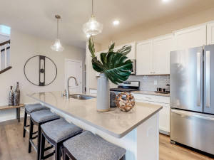 Photo for 7294 Bunker Lake Boulevard NW, Ramsey, MN 55303 - Listing #6123436 Photo of a different home with similar floorplan. Finishes and options may vary. Spacious kitchen with pantry and center island with room for four stools.