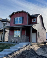 Photo for 7294 Bunker Lake Boulevard NW, Ramsey, MN 55303 - Listing #6123436 Front elevation features spacious covered porch with stone accents. Landscaping irrigation and sod included.