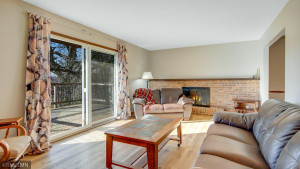 Photo for 2024 Eaglewood Circle, Shakopee, MN 55379 - Listing #6129537 Living room view of sliding glass doors and fireplace!!