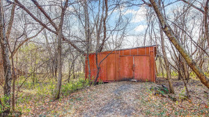 Photo for 2024 Eaglewood Circle, Shakopee, MN 55379 - Listing #6129537 Pole shed with concrete floors and wood burning stove