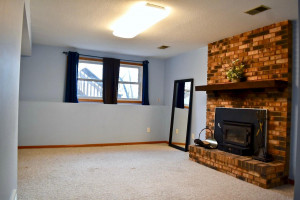Photo for 16755 Mankato Street NE, Ham Lake, MN 55304 - Listing #6124165 Finished lower level to include family room with look out windows. Enjoy the wood stove with brick surround on a cold winter night.