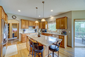 Photo for 850 Highlander Trail, Hudson, WI 54016 - Listing #6181718 Kitchen is equipped with ample storage space, newer stainless-steel appliances, granite countertops, and a center island