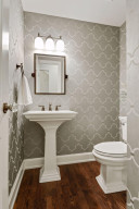 Photo for 3530 Edmund Boulevard, Minneapolis, MN 55406 - Listing #6205579 The guest half bath features a pedestal sink and hardwood floors.