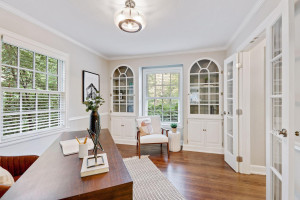 Photo for 3530 Edmund Boulevard, Minneapolis, MN 55406 - Listing #6205579 French doors lead from the front entry to the office, where you’ll find built-in cabinets to display your collectibles. Large windows provide peaceful views of the river path.