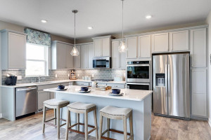 Photo for 12391 62nd Street NE, Otsego, MN 55301 - Listing #6195953 The kitchen is home to a large center island complete with granite countertops, stainless appliances, including double ovens and a luxurious gas cooktop. *pictures are of model, actual colors in home may vary.