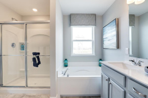 Photo for 12391 62nd Street NE, Otsego, MN 55301 - Listing #6195953 Separate tub-shower in primary bath makes this on-suite a relaxing oasis. *pictures are of model, actual colors in home may vary.