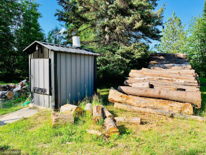 Photo for 2191 94th Avenue NW, Roosevelt, MN 56673 - Listing #6232894 Outdoor wood boiler with wood to heat the home
