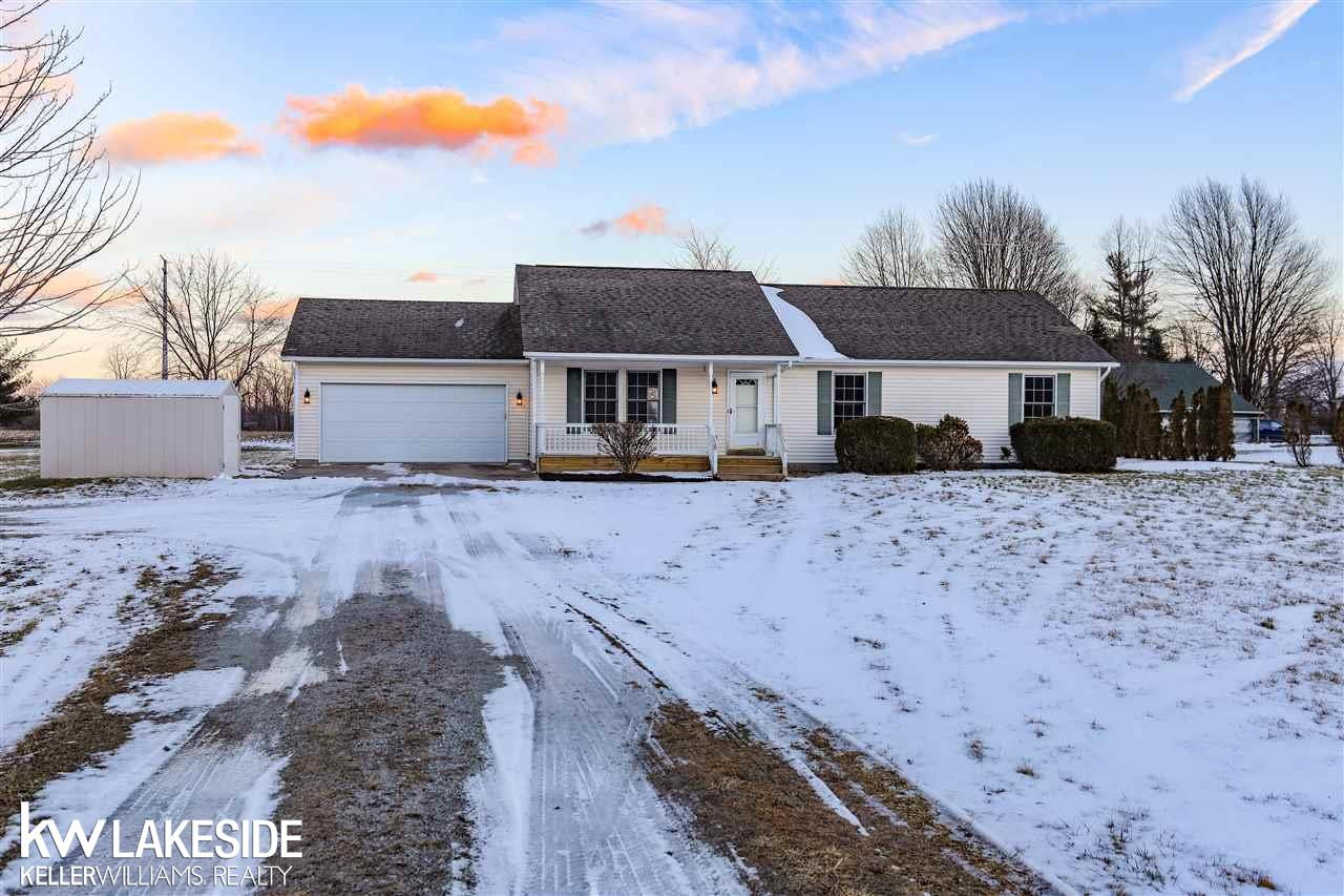 794 Cove Rd, Wales, MI — front exterior