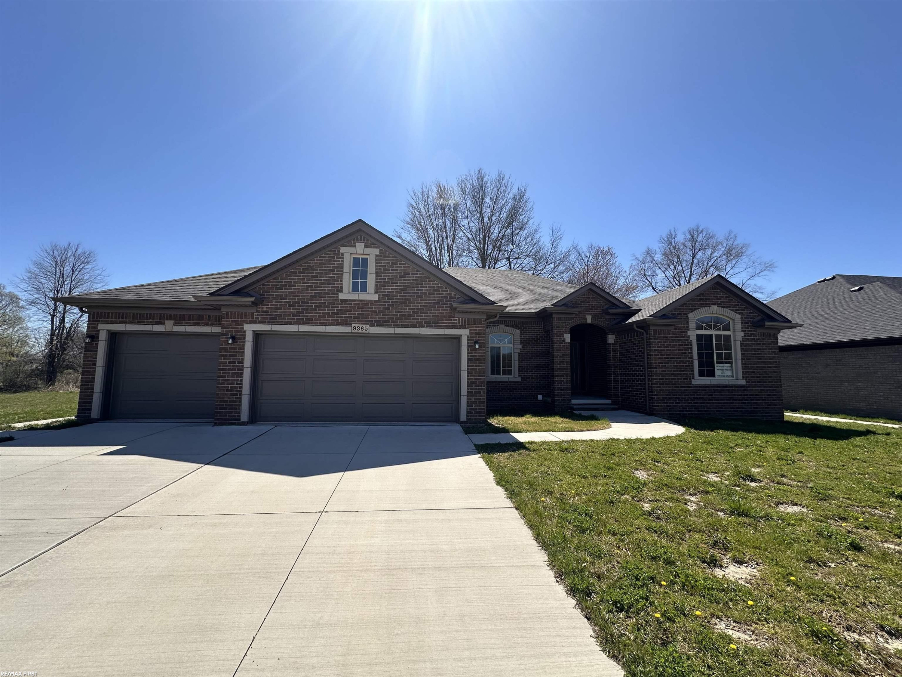 9365 Whistling Duck Road, 15, MI — front exterior