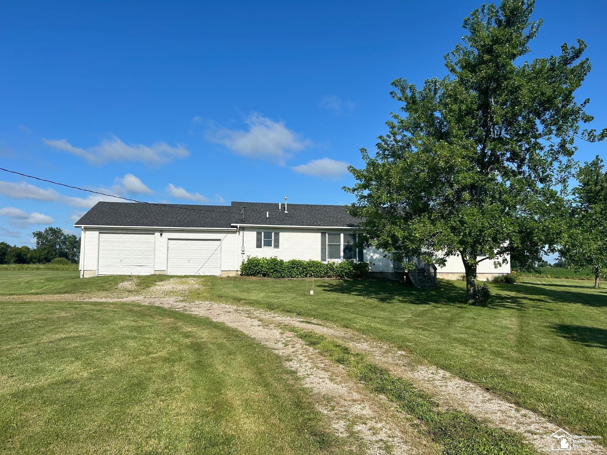 12185 Dennison, Milan, MI 48160 — front exterior