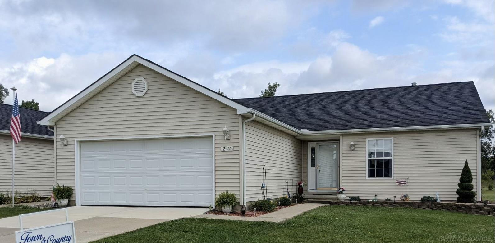 242 Quail Drive Drive, Capac, MI 48014 — front exterior