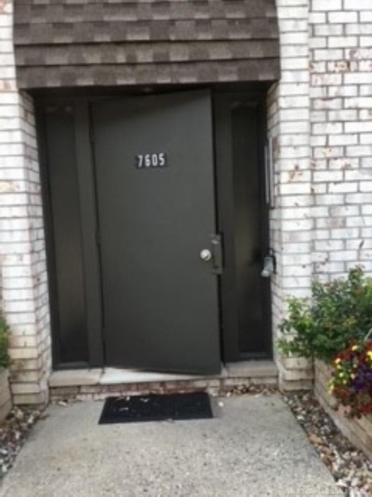 7605 Woodview Dr. 1 Drive, Bldg 12 unit 167, Westland, MI — front exterior