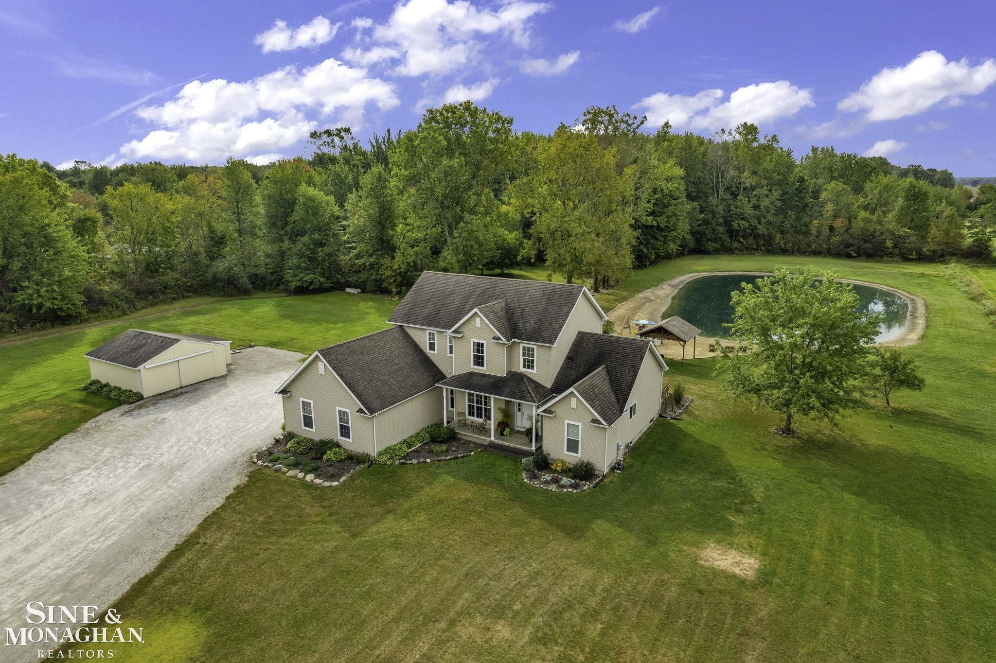 8673 Smiths Creek Road, Wales, MI — front exterior