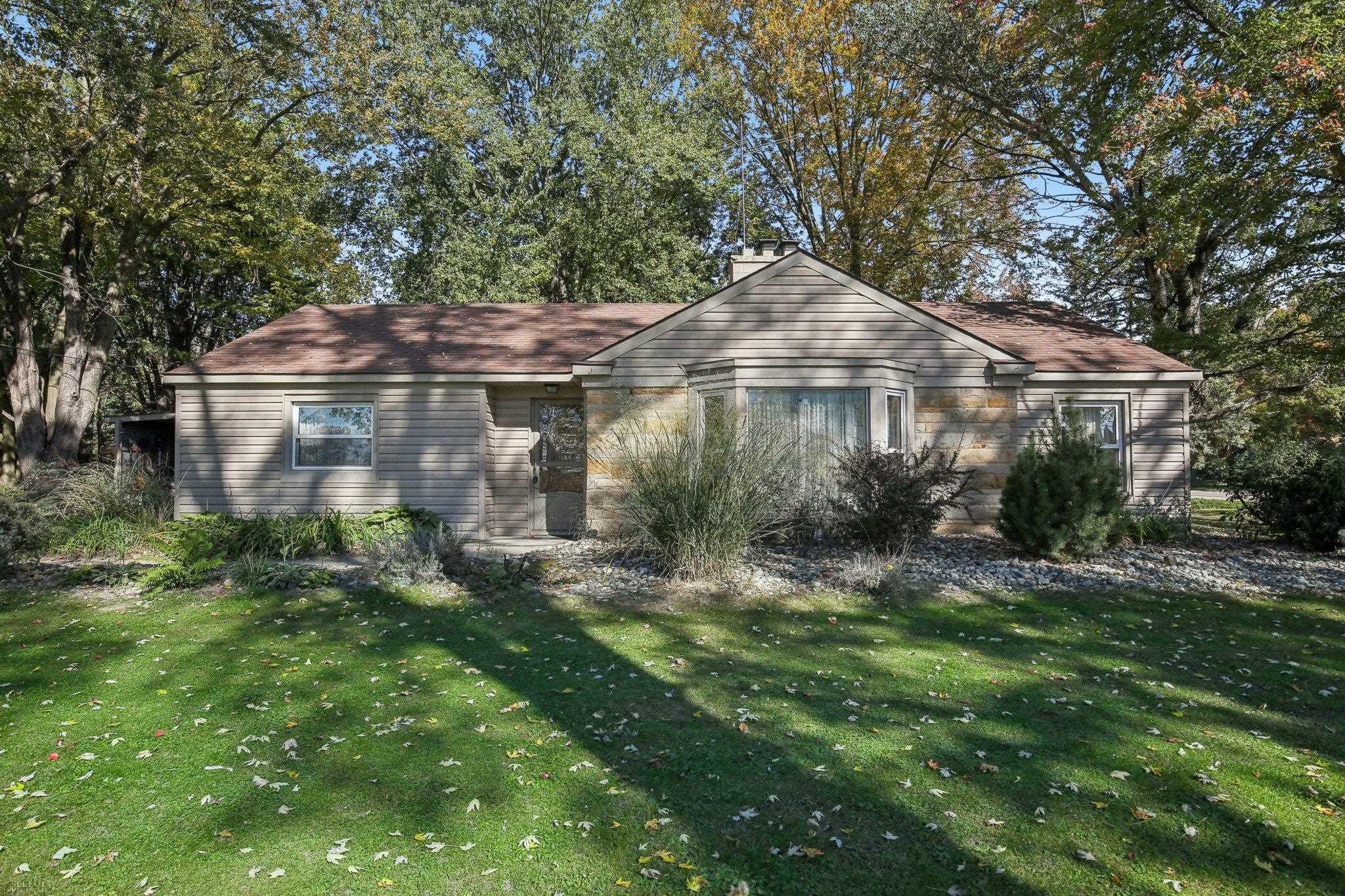 61025 Romeo Plank Road, MI — front exterior