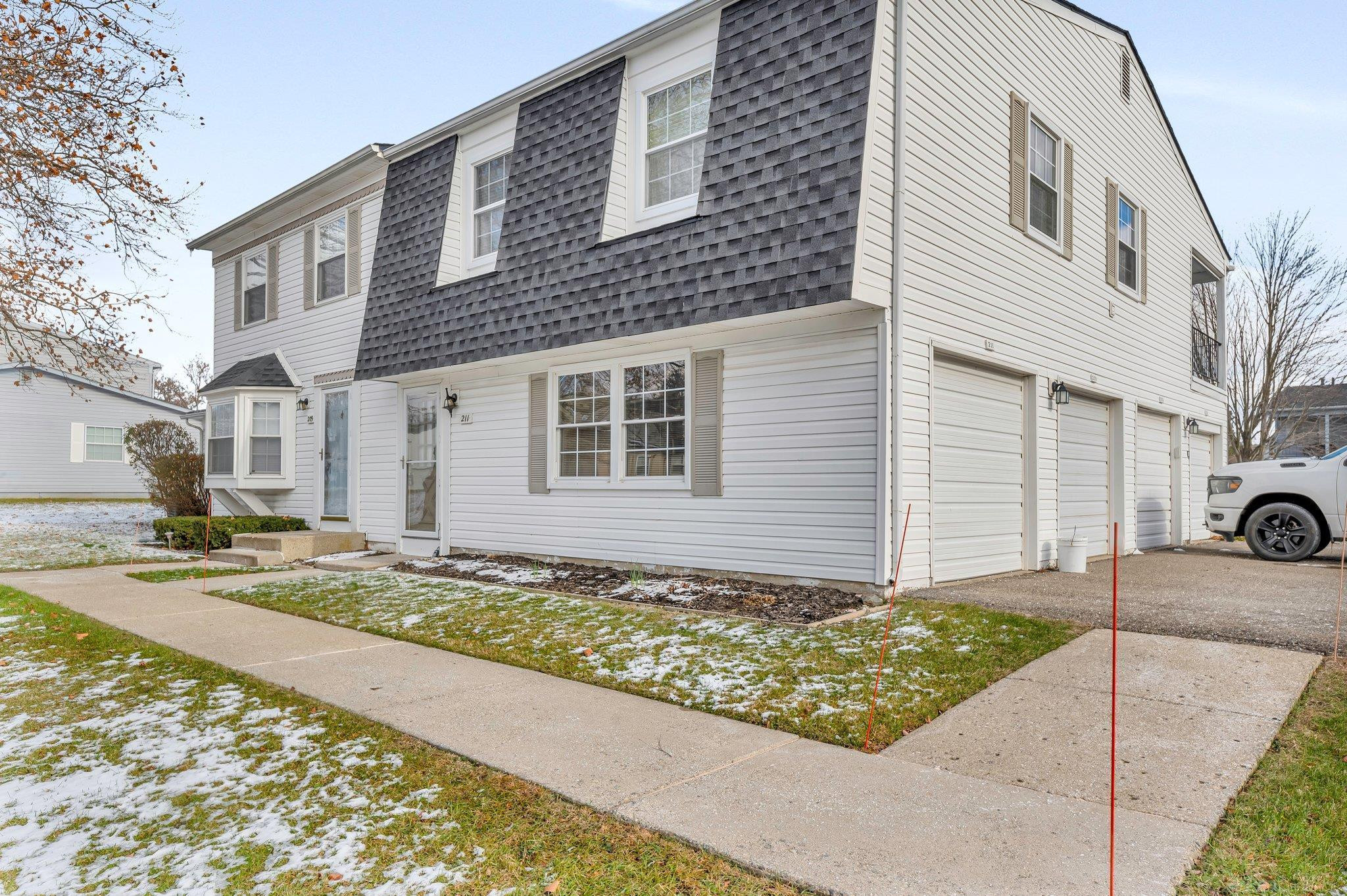 211 Lake Village Drive, Walled Lake, MI 48390 — front exterior