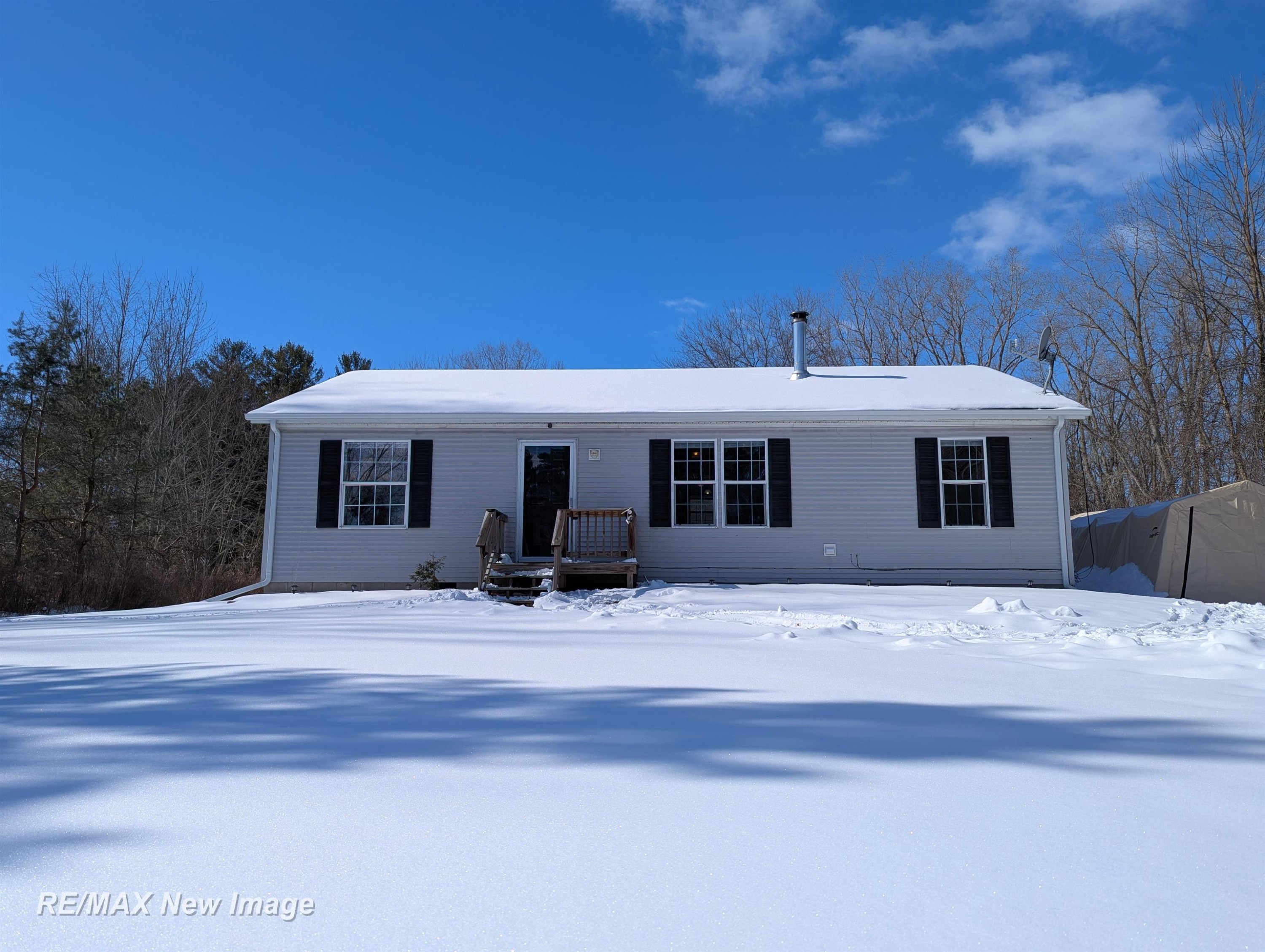 9610 East Road, Burt, MI 48417 — front exterior