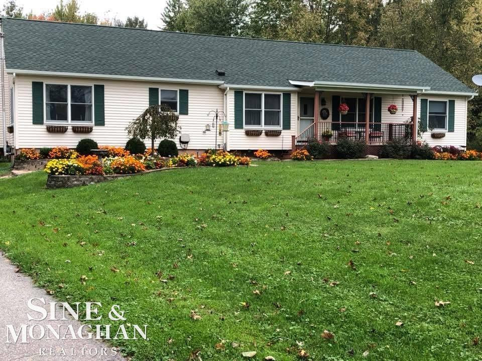 7256 Puttygut Road, MI — front exterior
