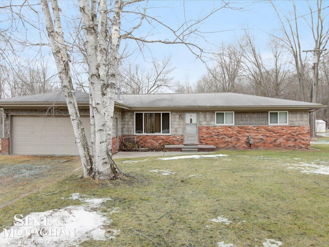 6266 Genaw Road, MI — front exterior