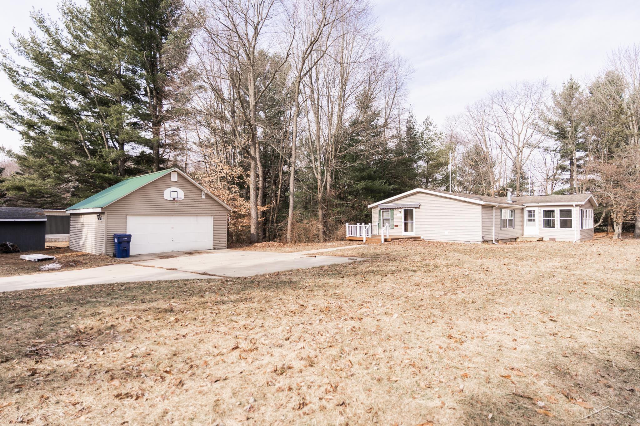1073 Carmen Drive, Weidman, MI 48893 — front exterior