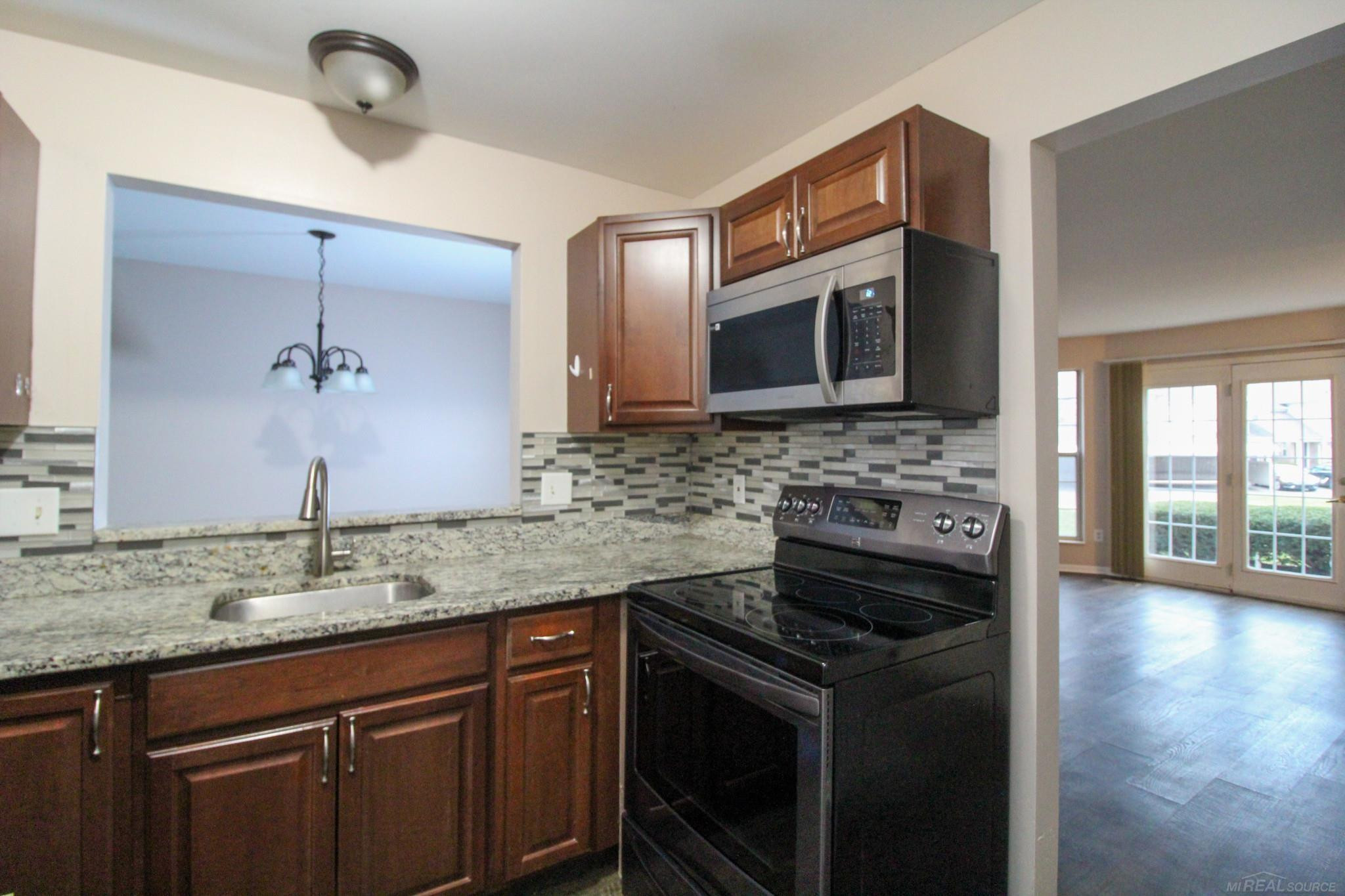 220 Oakbrooke Drive, 2, Lyons, MI 48178 — Photo 27