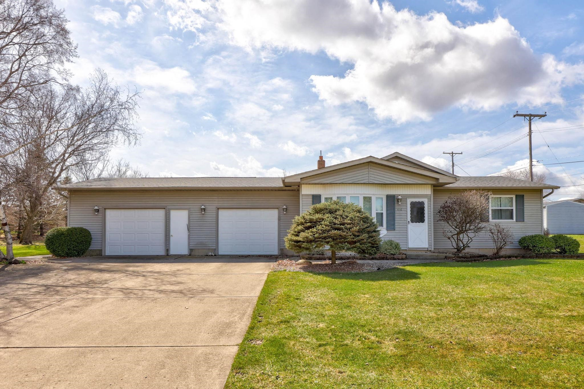416 Orchard Street, MI 48744 — front exterior