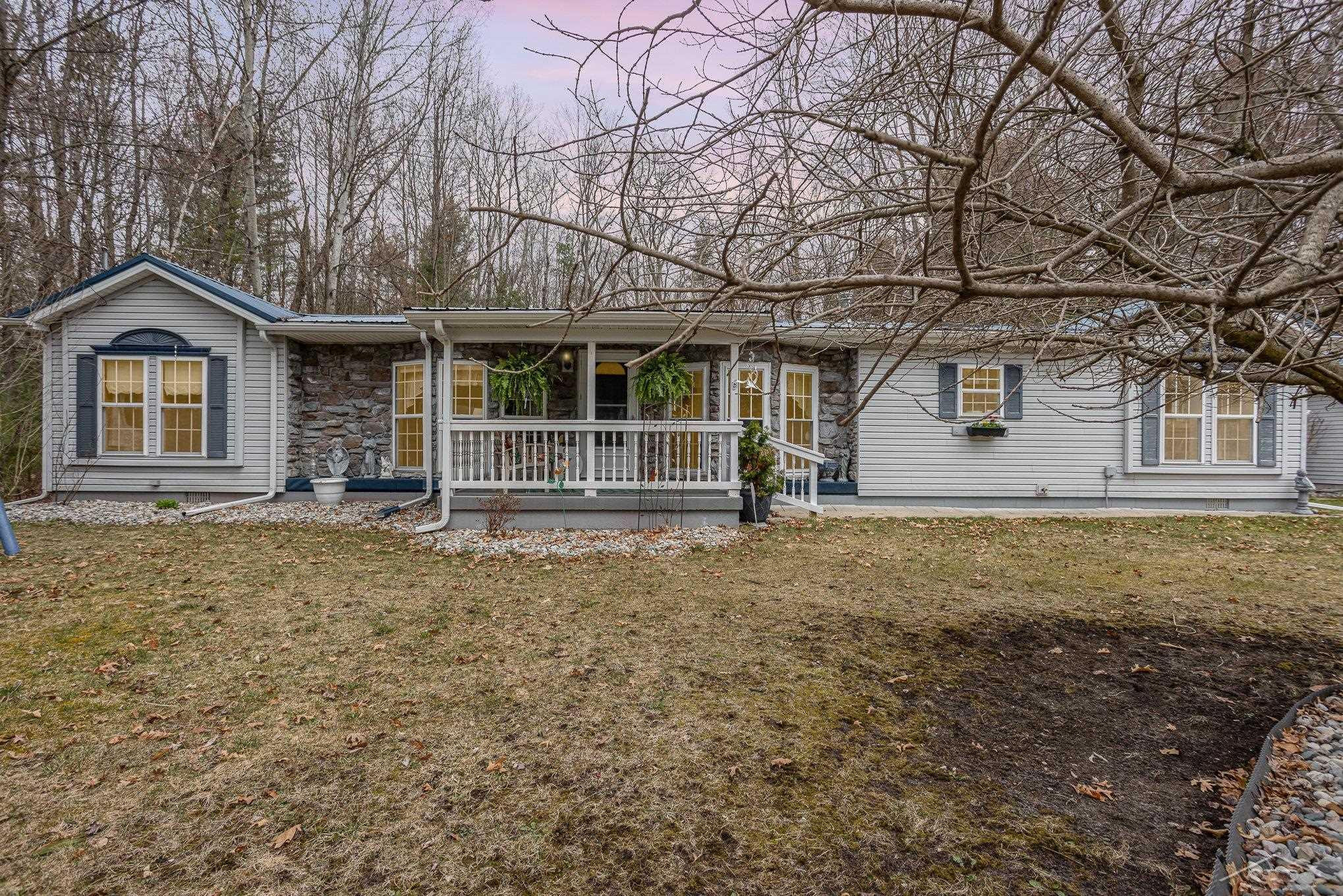 804 W Sand Beach Drive, Sanford, MI 48657 — front exterior