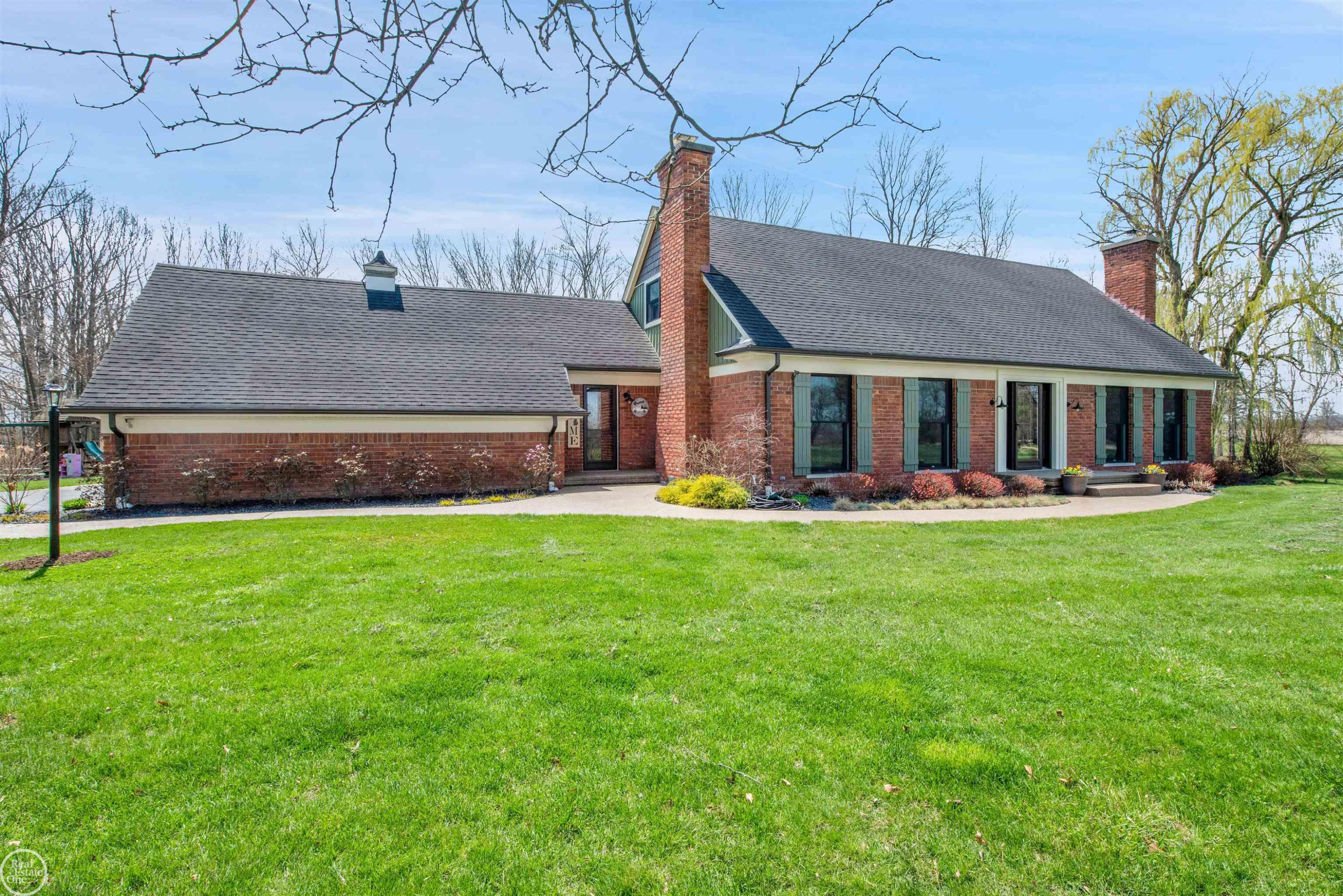 12245 Gilbert Road, MI — front exterior