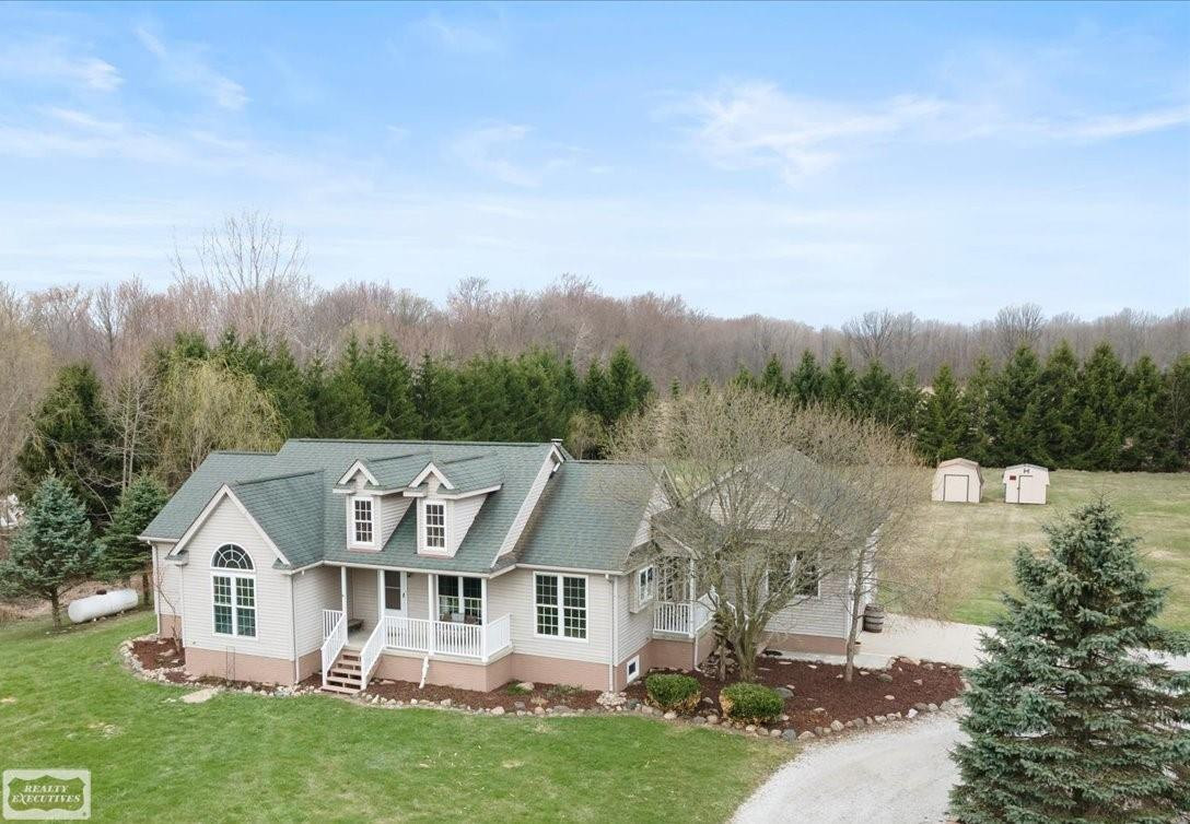 2455 Cove Road, Wales, MI — front exterior