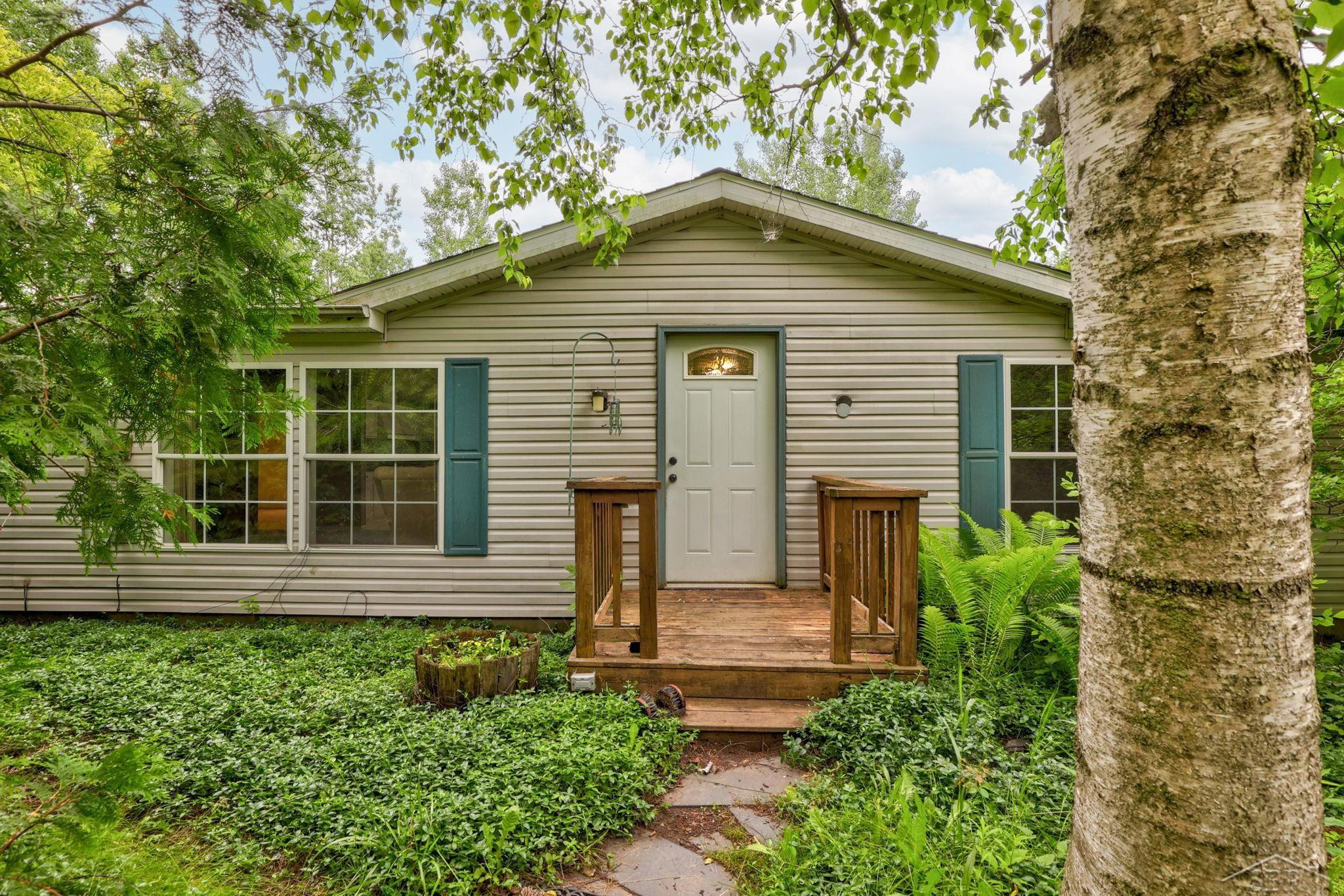 445 W Snover Road Road, MI 48744 — front exterior