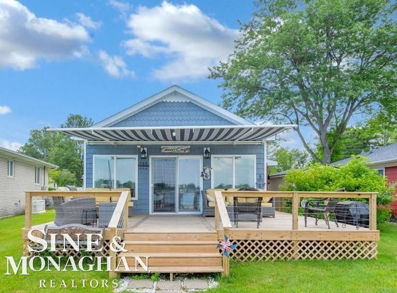 8669 River Road, MI — front exterior