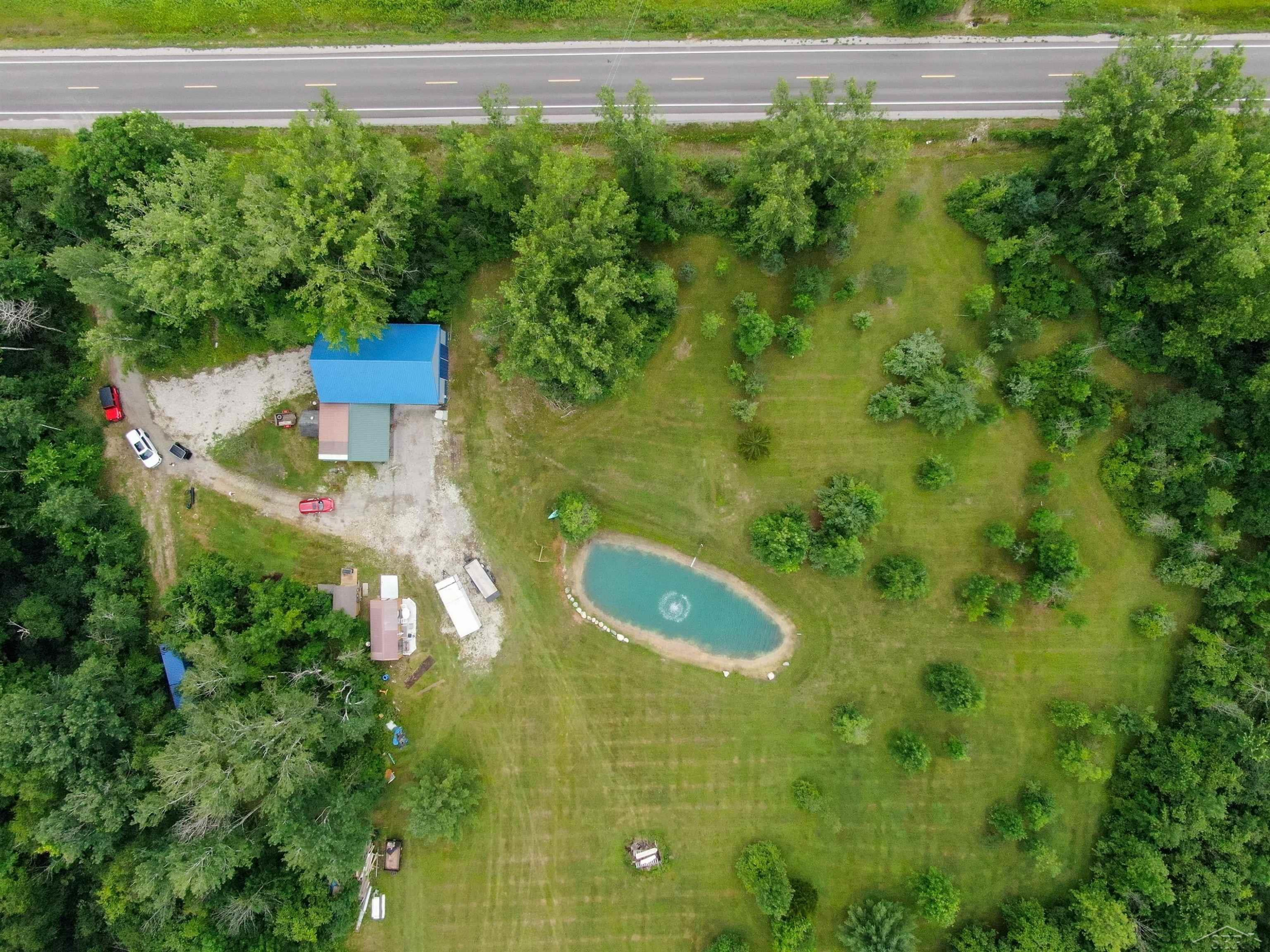 1080 W Curtis Road, Sanford, MI 48657 — front exterior