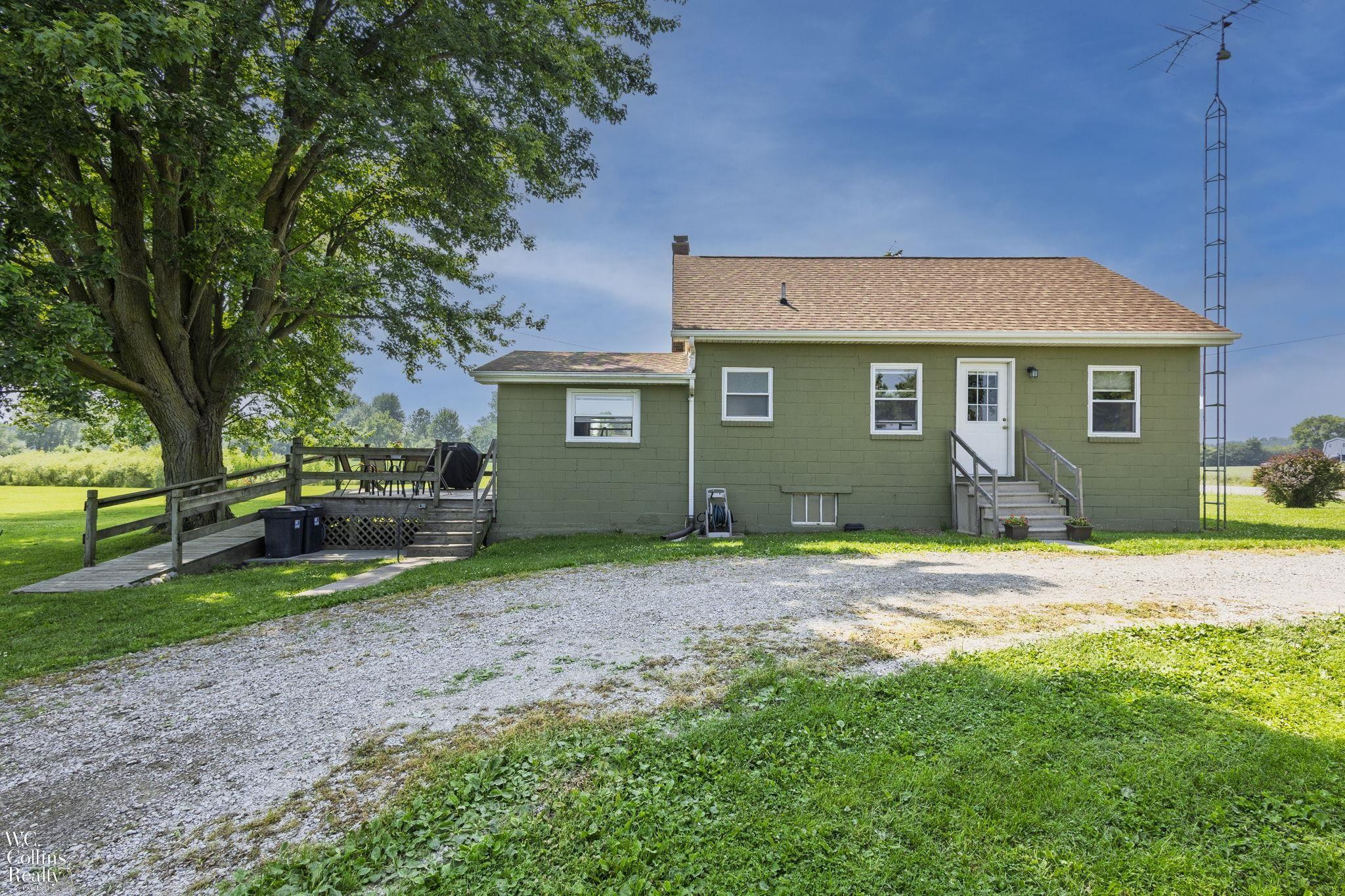 12069 Burt Road, MI — front exterior