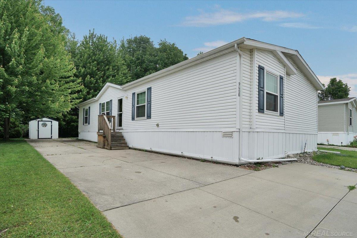 9608 Stoneypointe Drive, 129, MI — front exterior