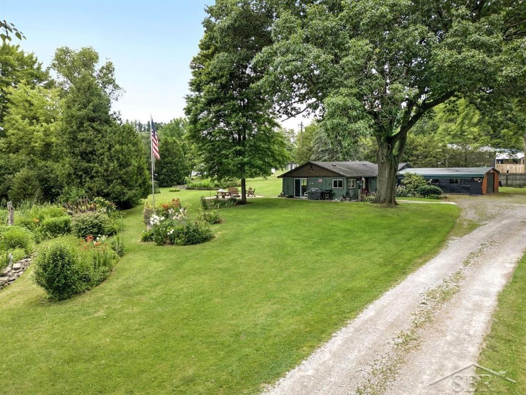 486 W Woodland Drive, Sanford, MI 48657 — front exterior