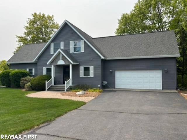 3922 S. Bay Bluffs Drive, Cedar, MI 49621 — front exterior