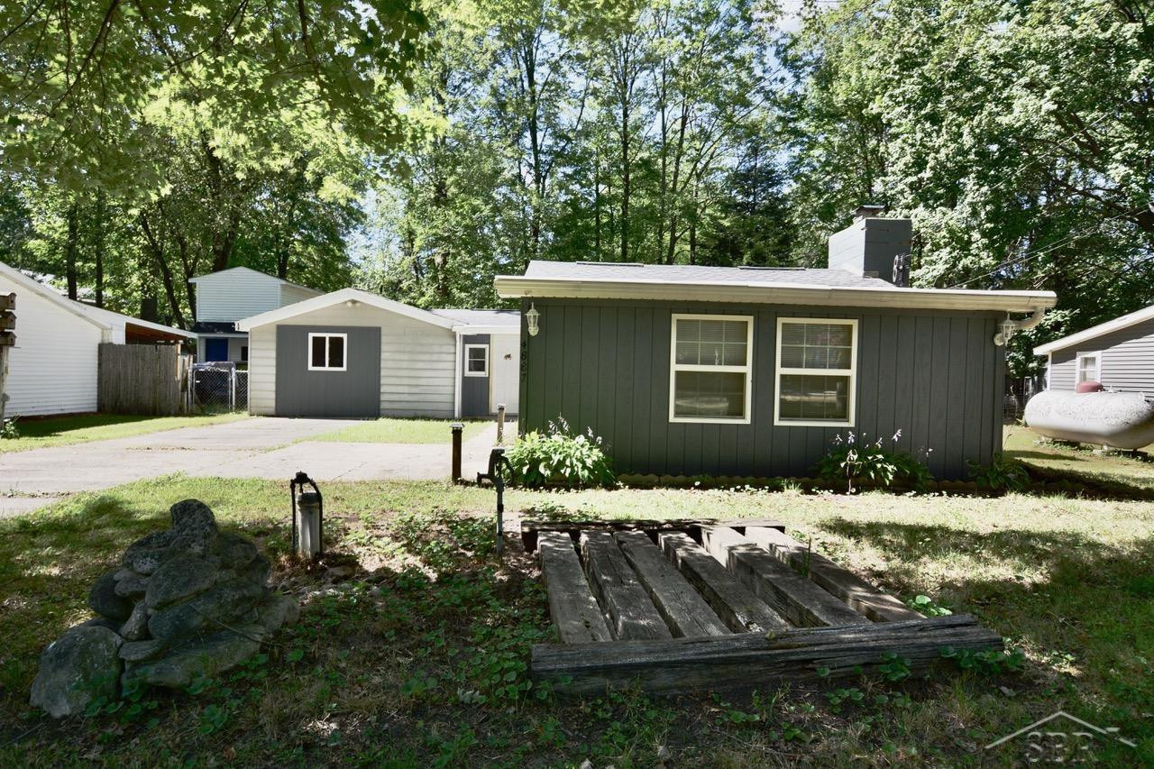 4887 Wildwood Street, Harrison, MI 48625 — front exterior